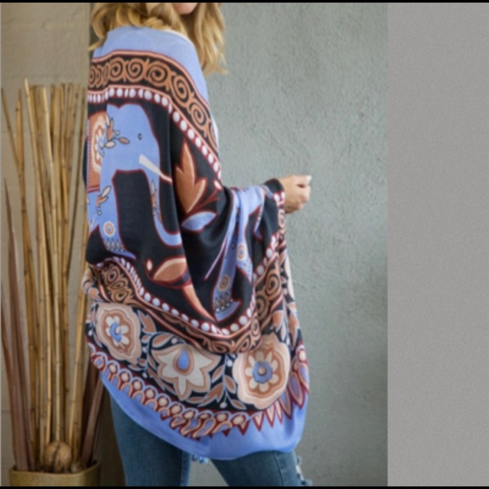 Beautiful elephant Moroccan print flower scarf with tassel accents.